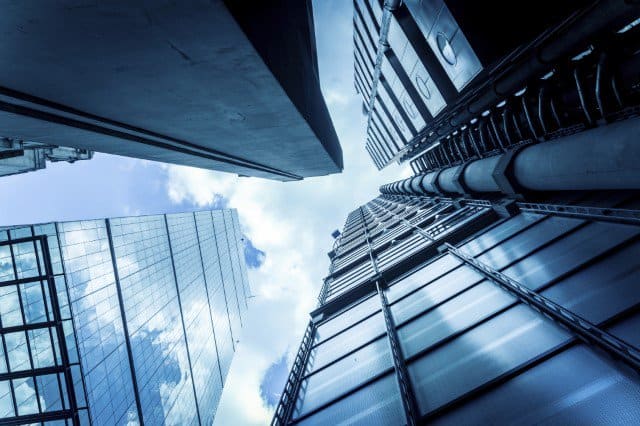 view of buildings from the bottom looking up