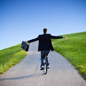 Businessman on unicycle e1375284545135