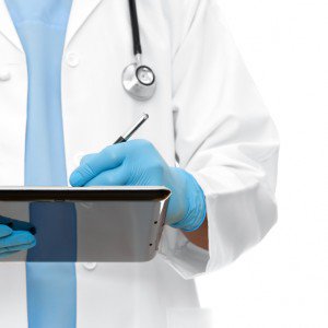 Healthcare Doctor Writing on Tablet e1395847099680
