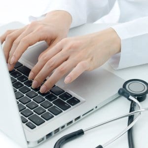 Healthcare Typing on Laptop cropped